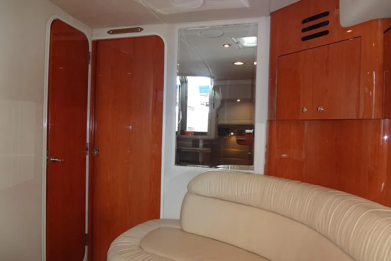Shel 'b' Gale Yacht Photos Pics Interior of 2001 Sea Ray 380 Sundancer with wood paneling and cream seating.