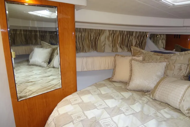 Shel 'b' Gale Yacht Photos Pics Luxurious cabin interior of 2001 Sea Ray 380 Sundancer yacht with elegant bedding.