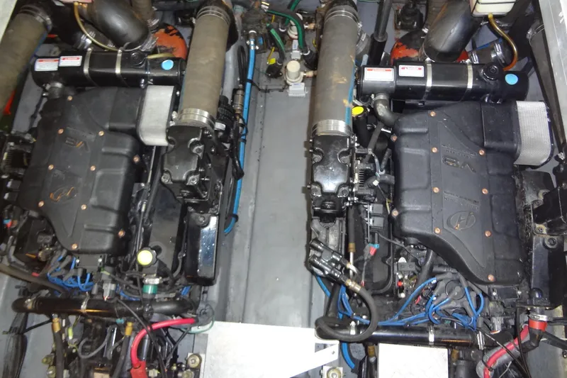 Shel 'b' Gale Yacht Photos Pics Engine compartment of a 2001 Sea Ray 380 Sundancer, showcasing dual inboard engines.