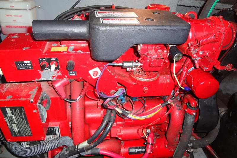 Shel 'b' Gale Yacht Photos Pics Red engine compartment of a 2001 Sea Ray 380 Sundancer boat, featuring wiring and controls.