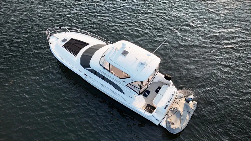 My Satin Doll Yacht Photos Pics 2001 Sea Ray 480 Sedan Bridge yacht on open water, aerial view.