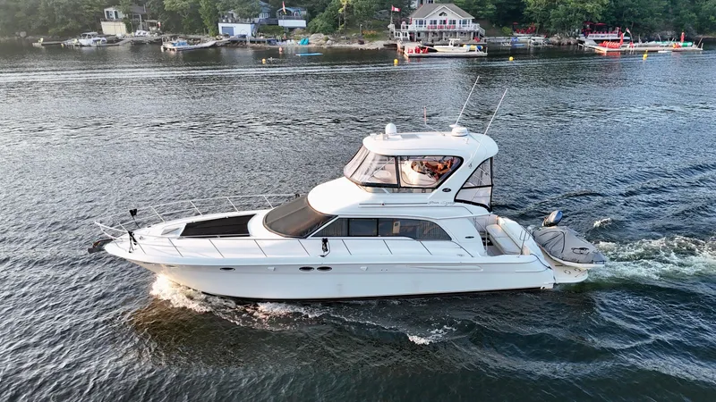 My Satin Doll Yacht Photos Pics 2001 Sea Ray 480 Sedan Bridge yacht cruising on a scenic waterway.