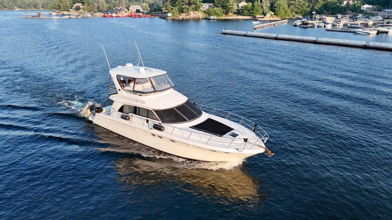 My Satin Doll Yacht Photos Pics 2001 Sea Ray 480 Sedan Bridge yacht cruising on a scenic lake.