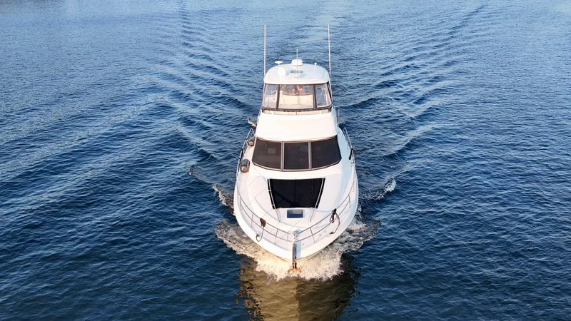 My Satin Doll Yacht Photos Pics 2001 Sea Ray 480 Sedan Bridge cruising on open water, aerial view.