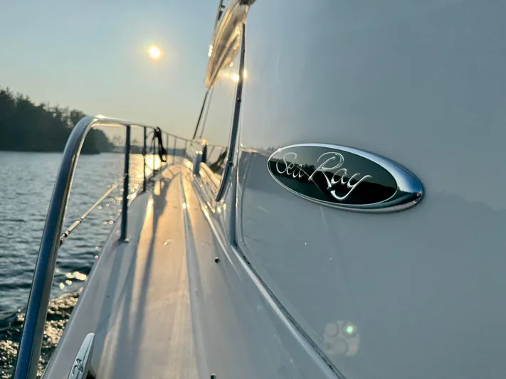 My Satin Doll Yacht Photos Pics 2001 Sea Ray 480 Sedan Bridge yacht on water at sunset.