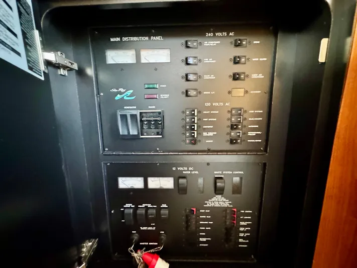 My Satin Doll Yacht Photos Pics Electrical panel of a 2001 Sea Ray 480 Sedan Bridge yacht, showing various switches and controls.