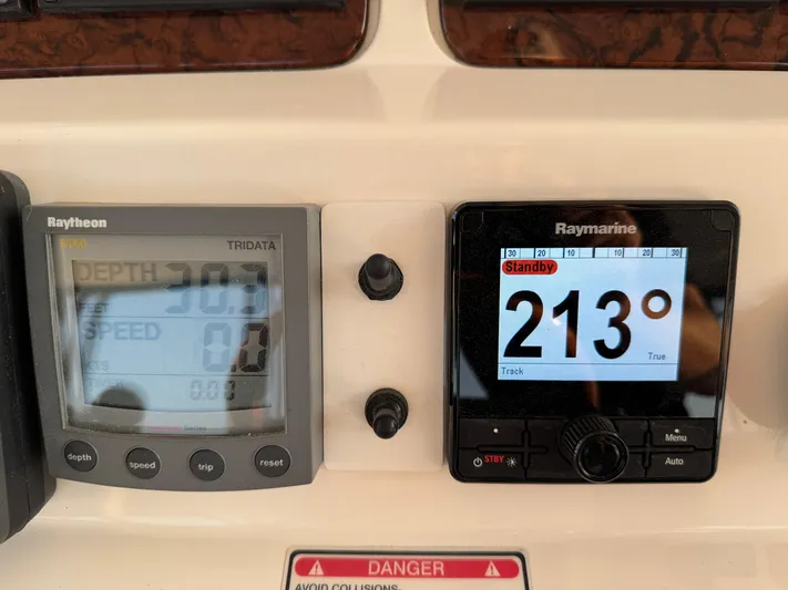 My Satin Doll Yacht Photos Pics Control panel of a 2001 Sea Ray 480 Sedan Bridge showing depth and compass readings.