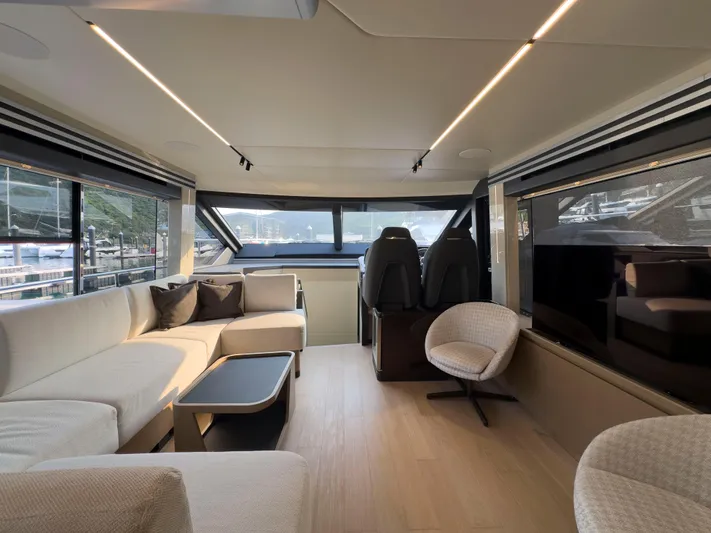  Yacht Photos Pics Luxurious interior of 2022 Absolute 60 Fly yacht with modern seating and panoramic windows.