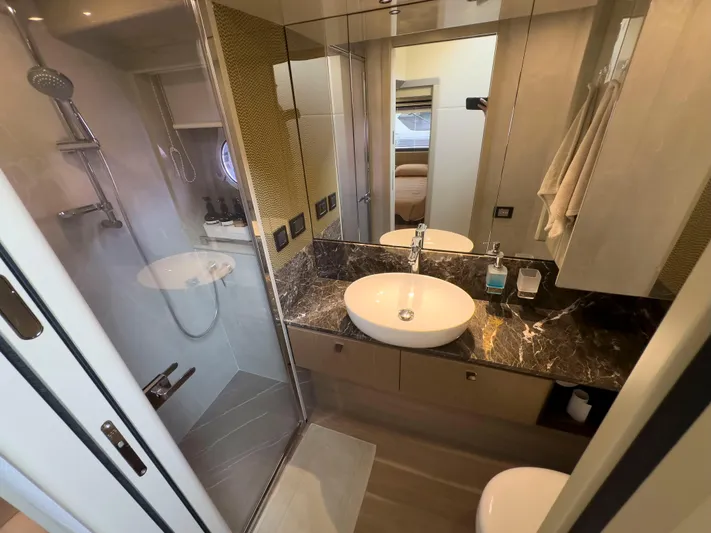  Yacht Photos Pics Luxurious bathroom in 2022 Absolute 60 Fly yacht with modern fixtures and marble countertop.
