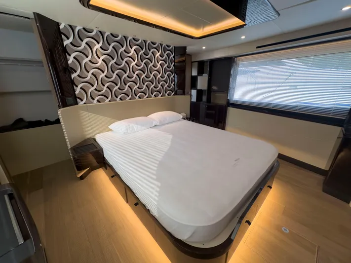  Yacht Photos Pics Luxurious bedroom interior of 2022 Absolute 60 Fly yacht with modern design elements.