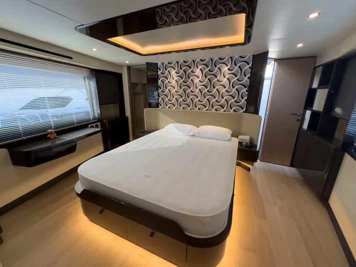  Yacht Photos Pics Luxurious bedroom interior of 2022 Absolute 60 Fly yacht with modern design elements.