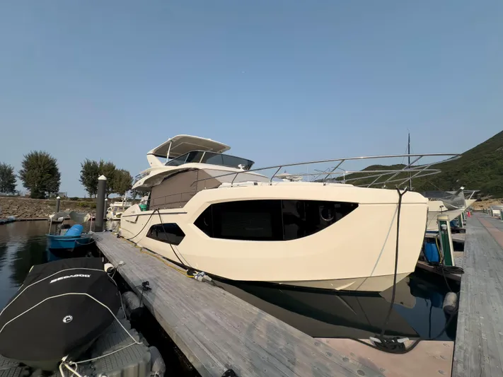  Yacht Photos Pics Luxury Absolute 60 Fly yacht docked at marina, 2022 model, sleek design.