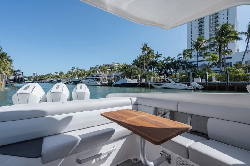 Pellicano Yacht Photos Pics 2023 Aviara AV36 OB boat interior with seating, table, and waterfront view.
