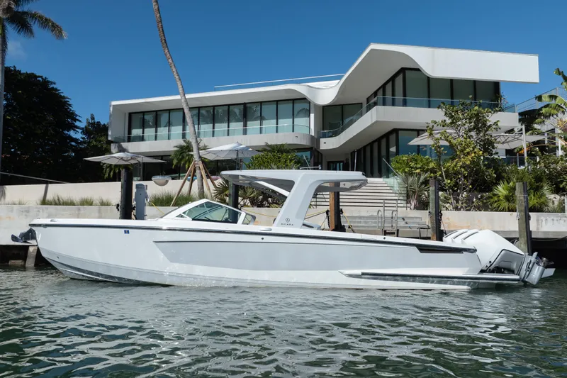 Pellicano Yacht Photos Pics 2023 Aviara AV36 OB boat docked near modern waterfront home.