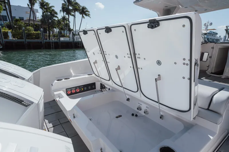 Pellicano Yacht Photos Pics 2023 Aviara AV36 OB boat storage compartments open by the water.