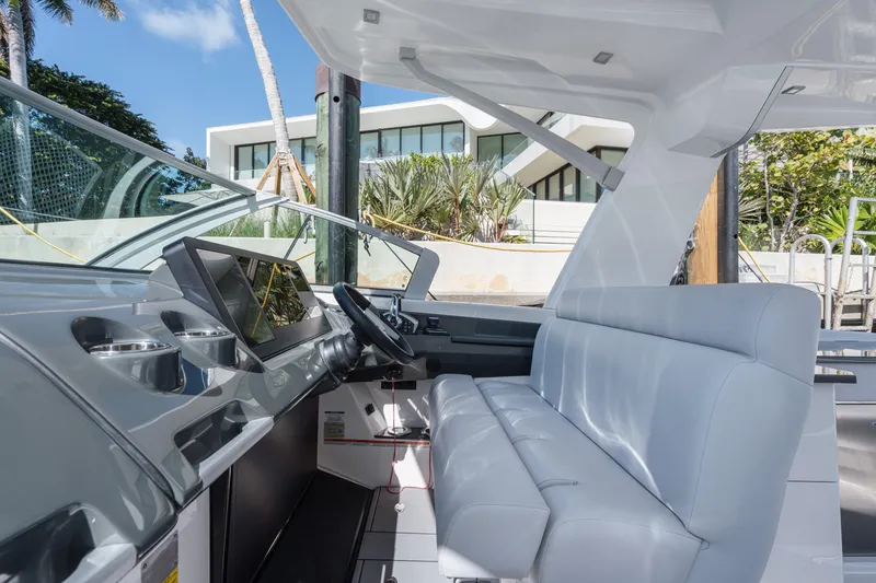 Pellicano Yacht Photos Pics 2023 Aviara AV36 OB boat interior with modern seating and dashboard.