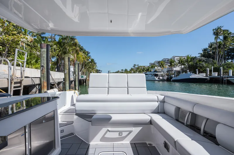Pellicano Yacht Photos Pics 2023 Aviara AV36 OB luxury boat interior with plush seating and waterfront view.