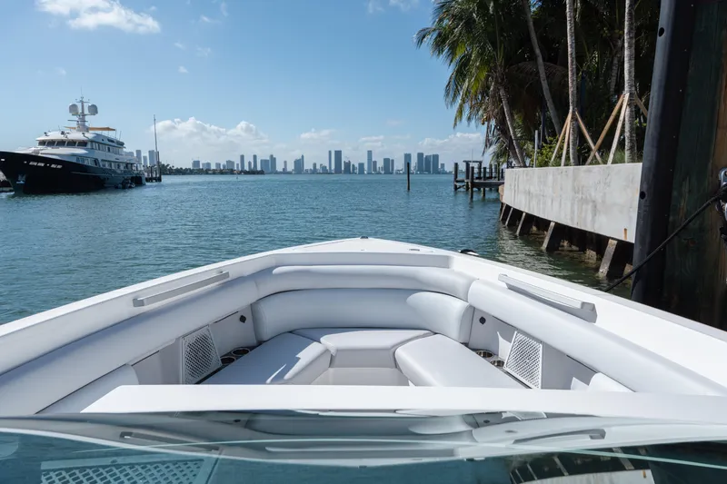 Pellicano Yacht Photos Pics 2023 Aviara AV36 OB boat with city skyline and palm trees in the background.