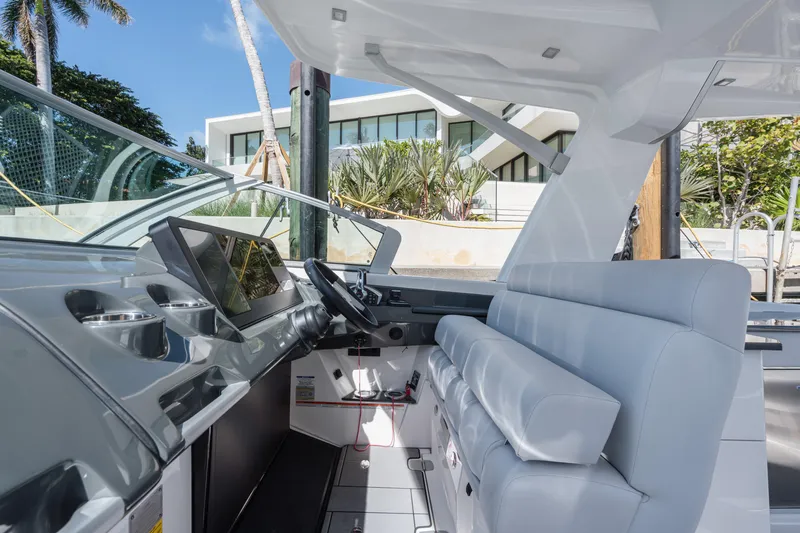 Pellicano Yacht Photos Pics 2023 Aviara AV36 OB boat interior with modern dashboard and seating.