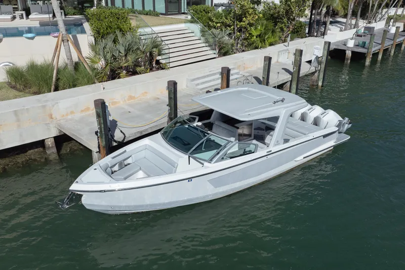 Pellicano Yacht Photos Pics 2023 Aviara AV36 OB luxury boat docked in a serene waterfront setting.