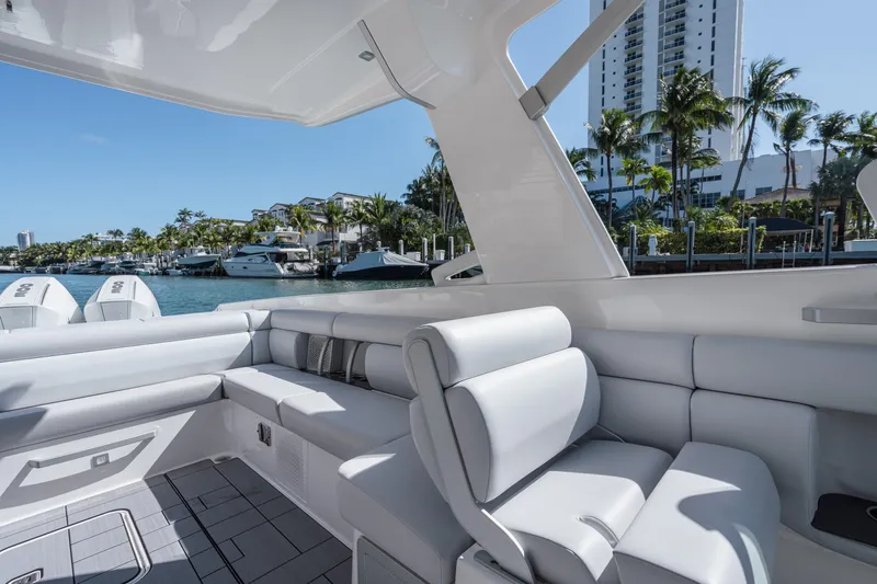 Pellicano Yacht Photos Pics 2023 Aviara AV36 OB luxury boat interior with sleek seating and waterfront view.