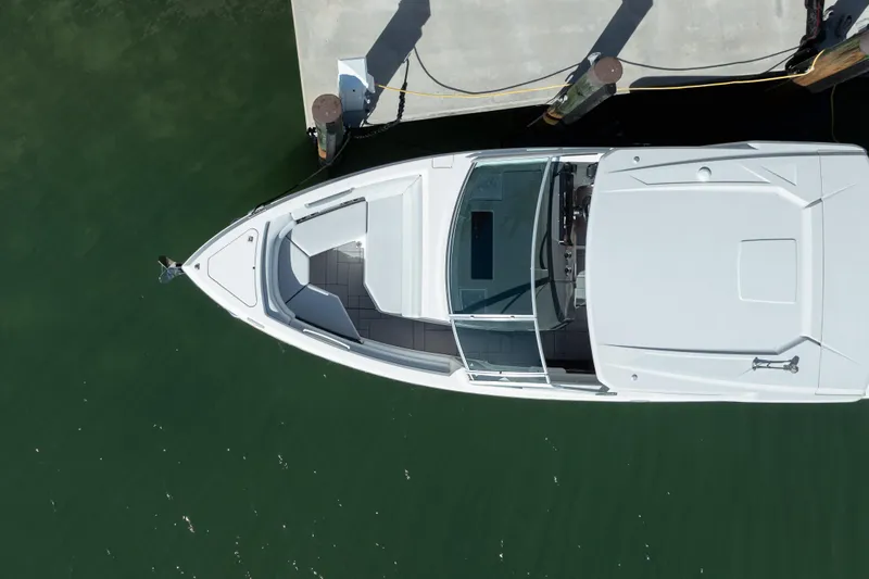 Pellicano Yacht Photos Pics Aerial view of 2023 Aviara AV36 OB boat docked on calm water.
