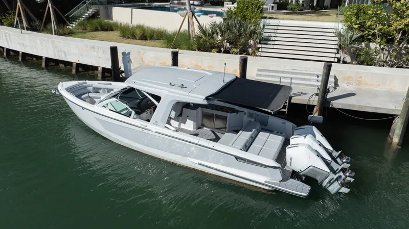 Pellicano Yacht Photos Pics 2023 Aviara AV36 OB luxury boat docked in a serene waterfront setting.
