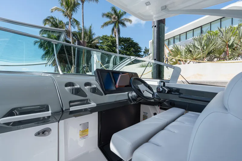 Pellicano Yacht Photos Pics 2023 Aviara AV36 OB boat interior with modern dashboard and steering wheel.