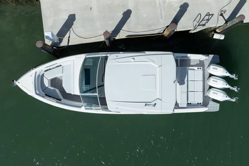 Pellicano Yacht Photos Pics Aerial view of 2023 Aviara AV36 OB boat docked on calm water.