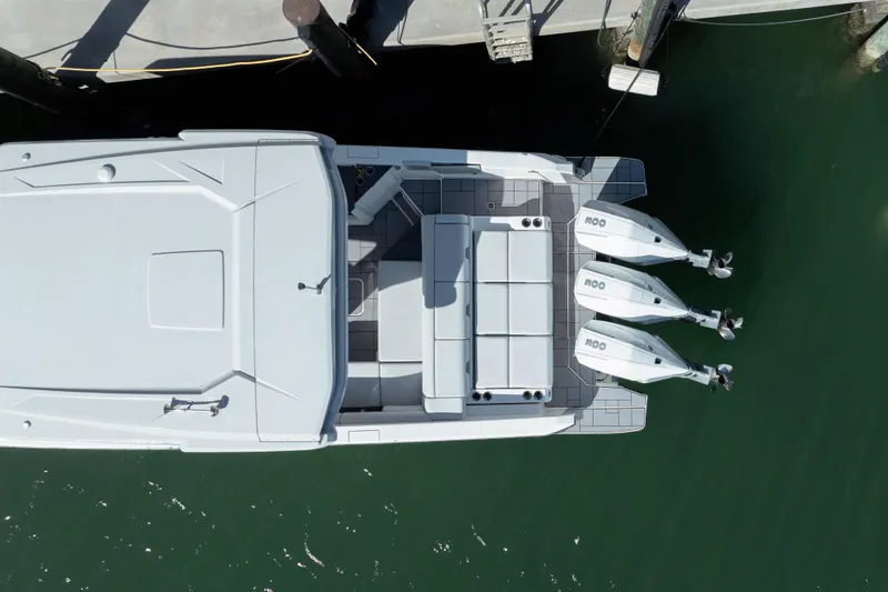 Pellicano Yacht Photos Pics Aerial view of 2023 Aviara AV36 OB boat docked with triple outboard engines.
