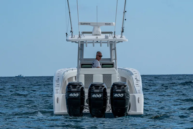  Yacht Photos Pics 2023 Invincible 36 Open Fisherman boat with four 400 horsepower engines on the ocean.