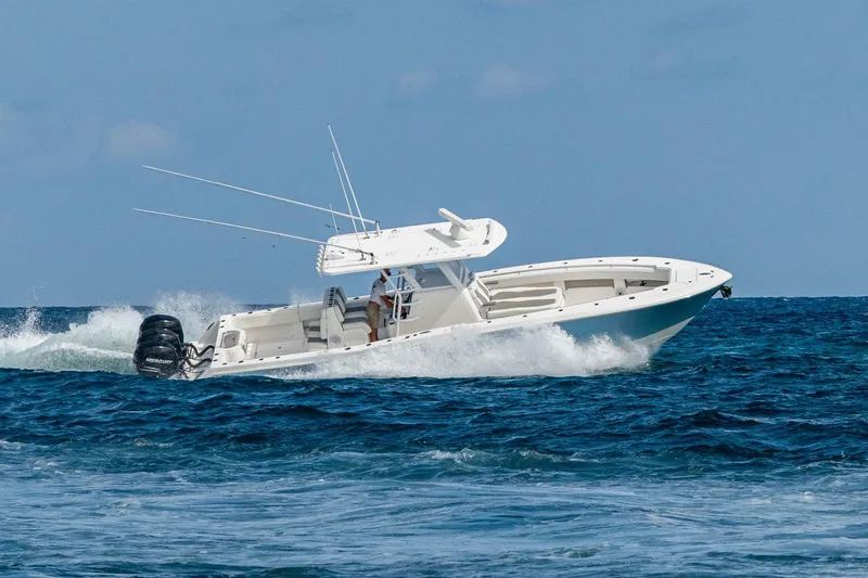  Yacht Photos Pics 2023 Invincible 36 Open Fisherman boat navigating ocean waves.