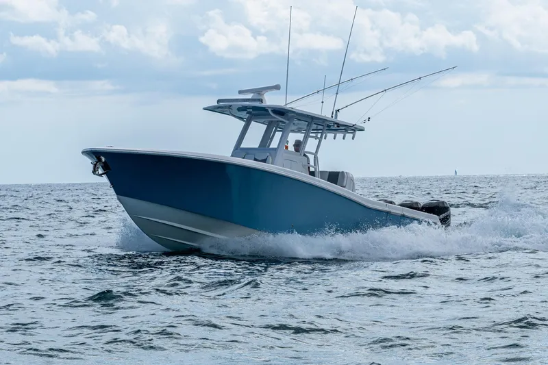  Yacht Photos Pics 2023 Invincible 36 Open Fisherman boat cruising on the ocean.