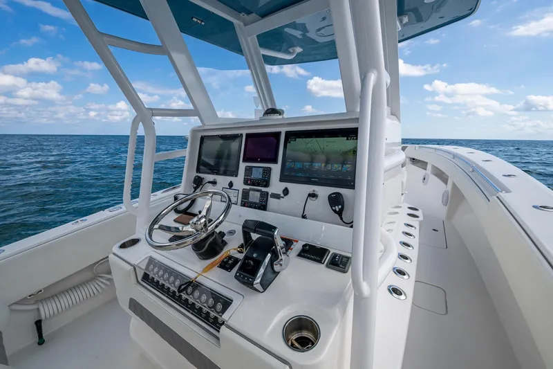  Yacht Photos Pics 2023 Invincible 36 Open Fisherman boat dashboard with ocean view.