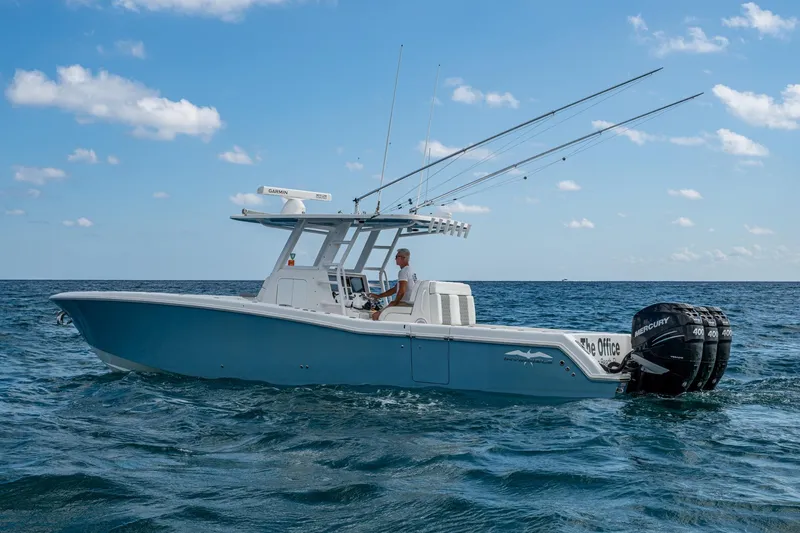  Yacht Photos Pics 2023 Invincible 36 Open Fisherman boat on ocean with triple Mercury engines.