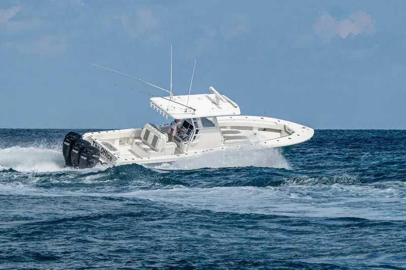  Yacht Photos Pics 2023 Invincible 36 Open Fisherman boat cruising on ocean waves.