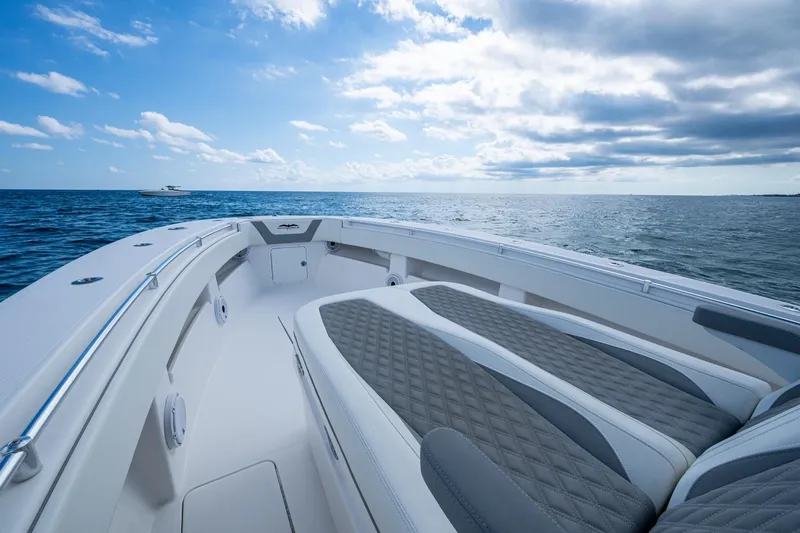  Yacht Photos Pics 2023 Invincible 36 Open Fisherman boat on open sea under cloudy sky.