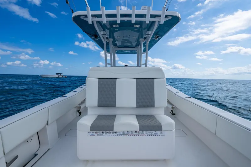  Yacht Photos Pics 2023 Invincible 36 Open Fisherman boat on open sea under blue sky.