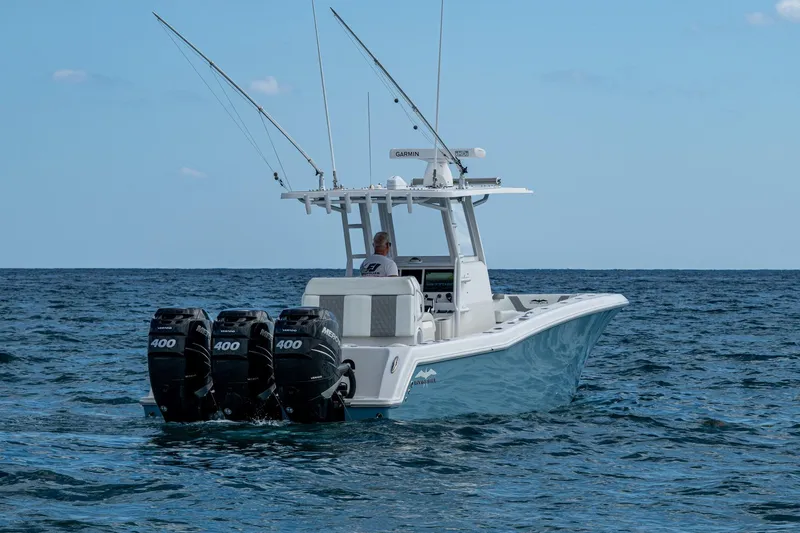  Yacht Photos Pics 2023 Invincible 36 Open Fisherman boat with triple 400 engines on open sea.