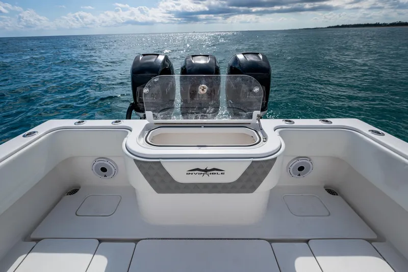  Yacht Photos Pics 2023 Invincible 36 Open Fisherman boat with triple engines on open sea.