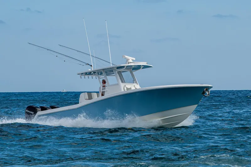  Yacht Photos Pics 2023 Invincible 36 Open Fisherman boat cruising on open ocean waters.