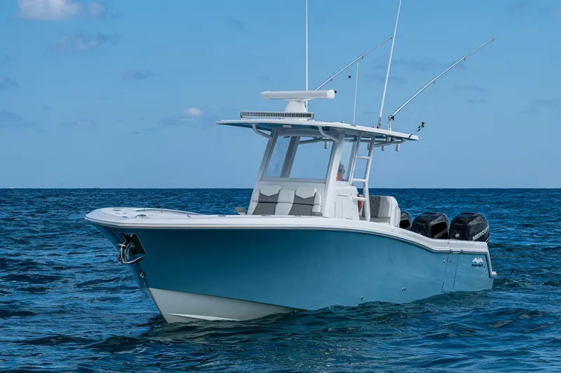  Yacht Photos Pics 2023 Invincible 36 Open Fisherman boat on open sea, featuring sleek design and powerful engines.