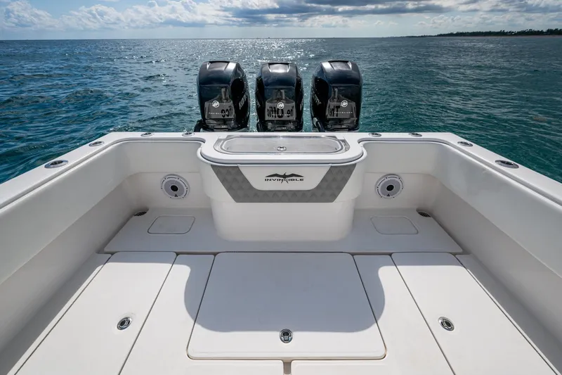  Yacht Photos Pics 2023 Invincible 36 Open Fisherman boat with triple engines on open sea.