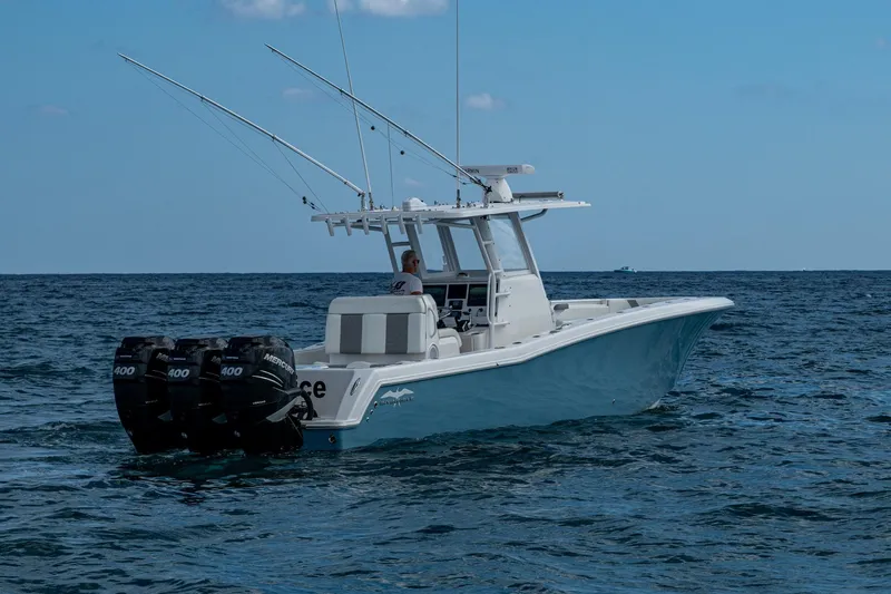  Yacht Photos Pics 2023 Invincible 36 Open Fisherman boat on open sea with triple engines.