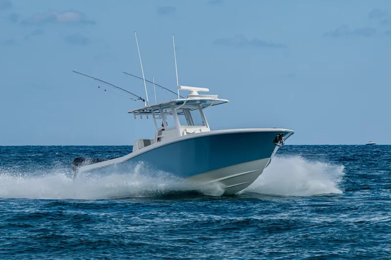  Yacht Photos Pics 2023 Invincible 36 Open Fisherman boat cruising on open water.