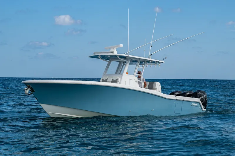  Yacht Photos Pics 2023 Invincible 36 Open Fisherman boat on open sea, clear sky background.