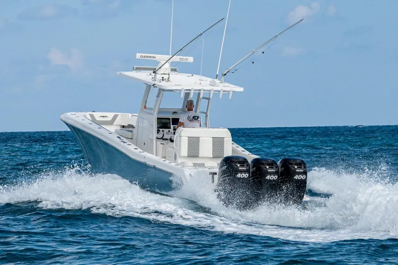  Yacht Photos Pics 2023 Invincible 36 Open Fisherman boat cruising on ocean with triple 400 engines.