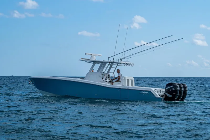  Yacht Photos Pics 2023 Invincible 36 Open Fisherman boat on open sea, clear sky background.