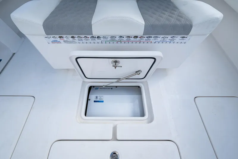  Yacht Photos Pics 2023 Invincible 36 Open Fisherman boat storage compartment with cushioned seating.