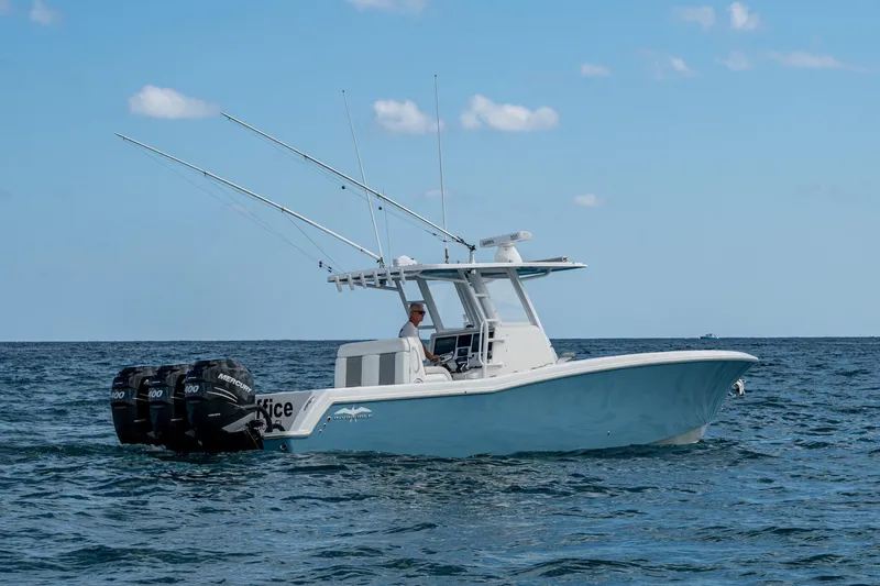  Yacht Photos Pics 2023 Invincible 36 Open Fisherman boat on the ocean with triple Mercury engines.